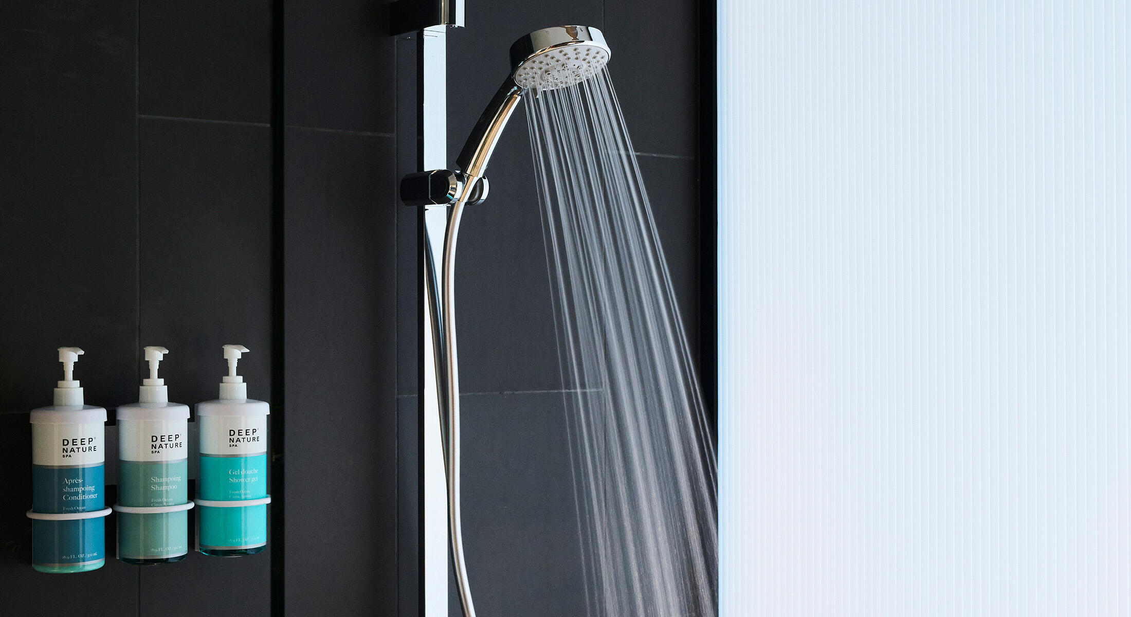 running shower with refillable bath amenities