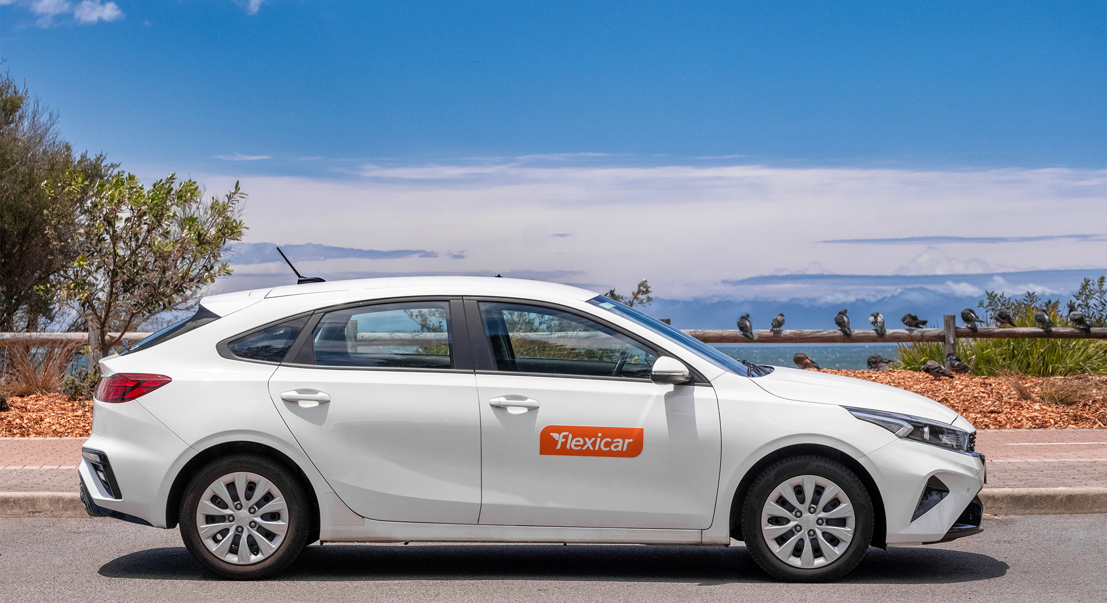 Modern Flexicar car share vehicle on the road, booked via app from Novotel Melbourne Airport